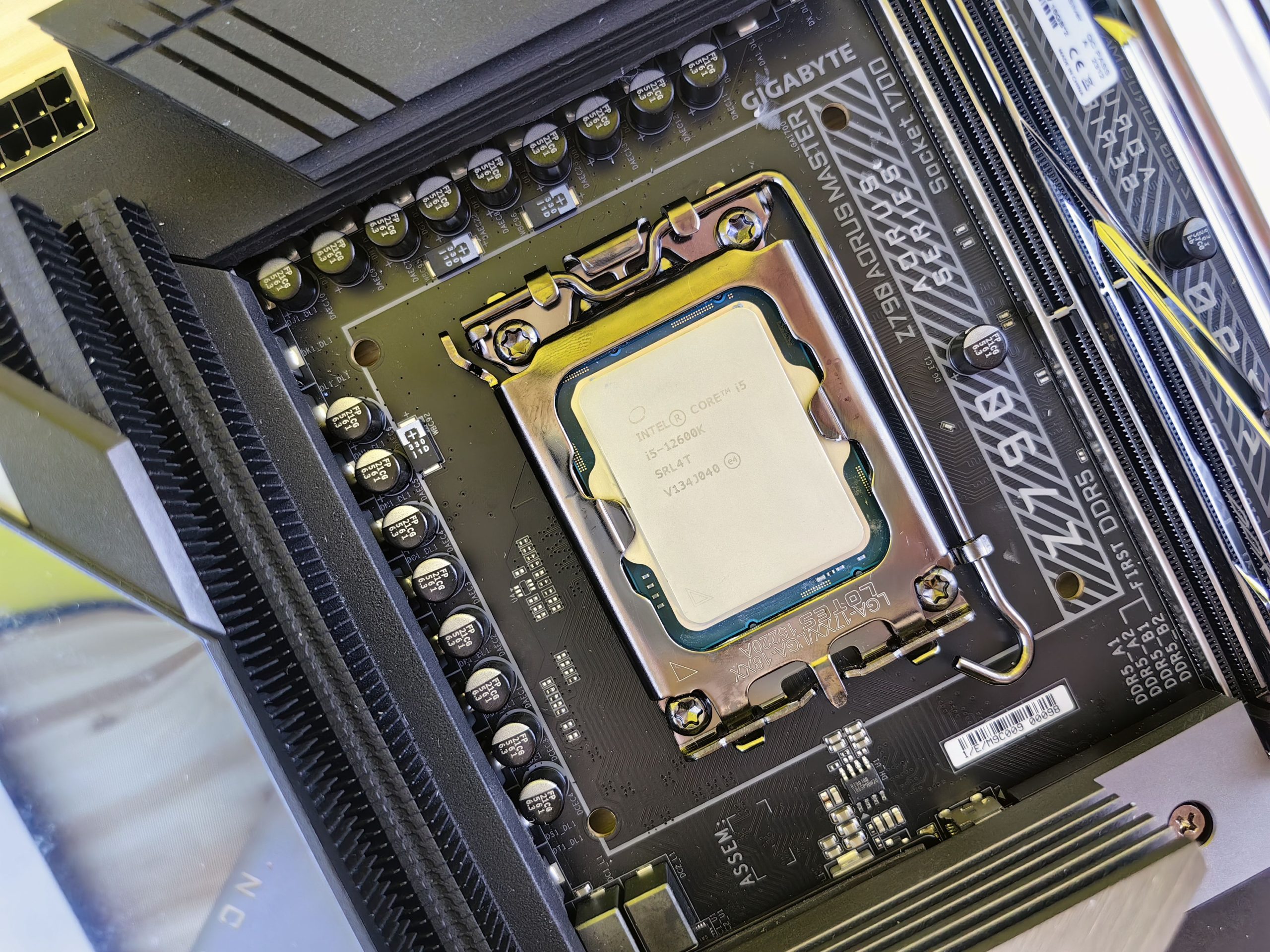 An Intel Core i5 processor installed in the socket of a Gigabyte Z790 AORUS Master motherboard